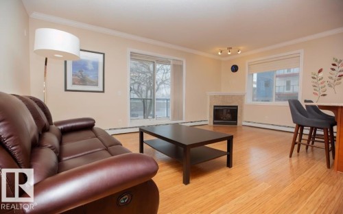 202 8631 108 Street, Edmonton, AB - Indoor Photo Showing Living Room With Fireplace
