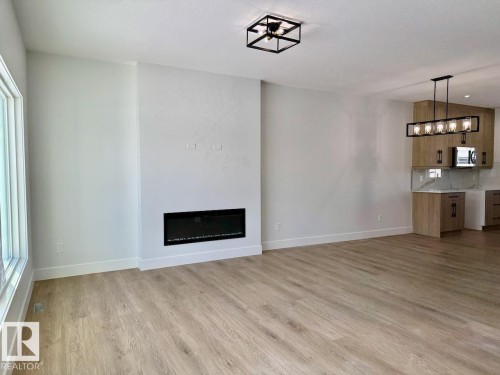 Upper 62 Wyatt Ridge, Fort Saskatchewan, AB - Indoor Photo Showing Living Room With Fireplace