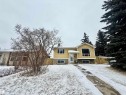 Split-level residence featuring yellow siding, a prominent bay window, and a white front entry door - 3520 17B Avenue, Edmonton, AB  - Outdoor With Facade 