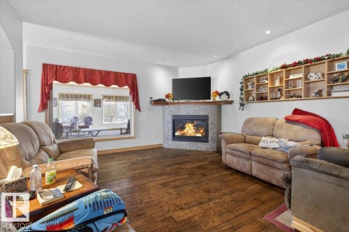 57 Longview Drive, Spruce Grove, AB - Indoor Photo Showing Living Room With Fireplace