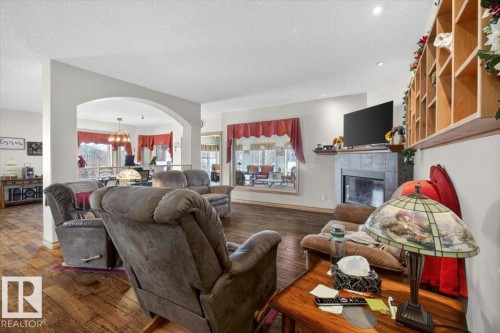 57 Longview Drive, Spruce Grove, AB - Indoor Photo Showing Living Room With Fireplace