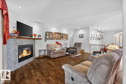 57 Longview Drive, Spruce Grove, AB - Indoor Photo Showing Living Room With Fireplace