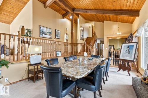 Vaulted wood-paneled ceiling with exposed beams - 11707 29 Avenue Nw, Edmonton, AB - Indoor Photo Showing Dining Room