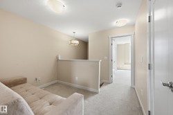 This property features light-colored carpet, neutral walls, and white trim throughout - 