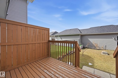 Outdoor deck area featuring wooden planks and a privacy fence - 701 Allard Boulevard, Edmonton, AB - Outdoor With Exterior