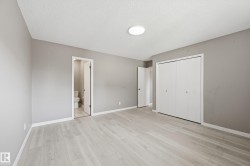 This room features light-colored flooring, neutral-toned walls, and a recessed ceiling light fixture - 