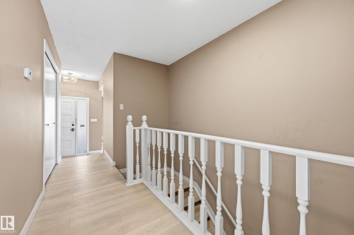 The entry features light-toned flooring and a white front door - 6907 19 Avenue, Edmonton, AB - Indoor Photo Showing Other Room