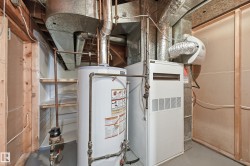 The utility room includes a water heater, furnace, and built-in shelving - 