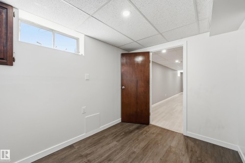 This room features a window, recessed lighting, and wood-look flooring - 6907 19 Avenue, Edmonton, AB - Indoor Photo Showing Other Room