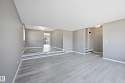The interior features light gray walls and light-colored flooring, creating a bright and airy atmosphere - 