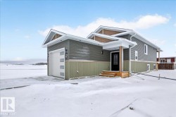 Contemporary home exterior featuring horizontal siding in a multi-tone color palette - 