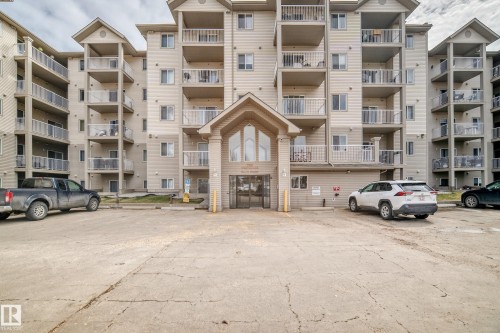The property features a multi-story exterior with balconies - 317 7511 171 Street, Edmonton, AB - Outdoor With Balcony With Facade