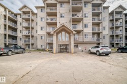 The property features a multi-story exterior with balconies - 