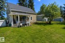 Rear exterior with metal roof and covered porch - 5213 49 Ave, St. Paul Town, AB  - Outdoor 