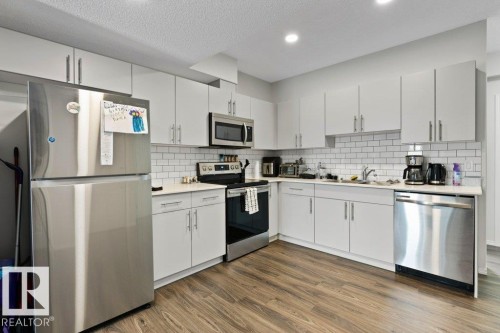 9939 222 Street, Edmonton, AB - Indoor Photo Showing Kitchen With Stainless Steel Kitchen With Double Sink With Upgraded Kitchen