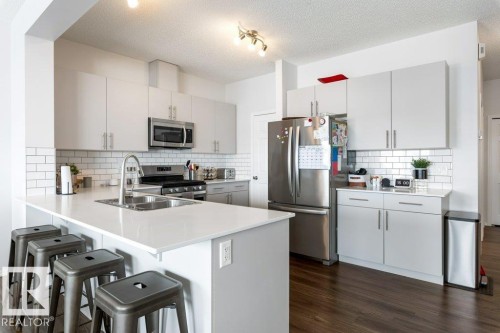 9939 222 Street, Edmonton, AB - Indoor Photo Showing Kitchen With Stainless Steel Kitchen With Double Sink With Upgraded Kitchen