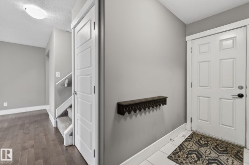 Entryway featuring a white paneled door and light gray wall paint - 2017 Westerra Loop, Stony Plain, AB - Indoor Photo Showing Other Room