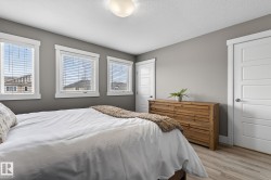 Interior room featuring light wood-finish flooring and a neutral wall color - 