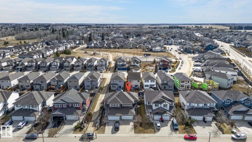 Residential neighborhood featuring a consistent architectural style, detached homes, and paved streets - 2017 Westerra Loop, Stony Plain, AB - Outdoor With View