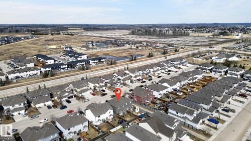 Aerial perspective showcasing a residential neighborhood with detached homes and townhouses - 2017 Westerra Loop, Stony Plain, AB - Outdoor With View