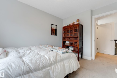 Light grey walls and plush carpeting - 11 4835 Wright Drive, Edmonton, AB - Indoor Photo Showing Bedroom