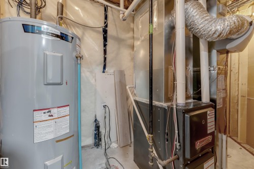 Water heater and furnace systems - 11 4835 Wright Drive, Edmonton, AB - Indoor Photo Showing Basement