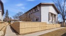 Exterior featuring light-colored stucco and light brown siding, with a pitched roofline - 12 14120 80 Street, Edmonton, AB  - Outdoor With Exterior 
