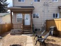 The property features a fenced yard with a wooden deck and staircase leading to the entrance - 10231 163 Street, Edmonton, AB  - Outdoor 