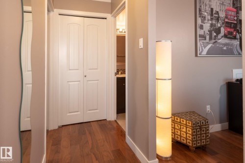 Hardwood flooring extending through a hallway with painted walls - 86 13435 97 Street, Edmonton, AB - Indoor Photo Showing Other Room