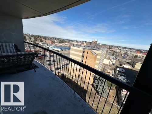 Balcony with a black metal railing and concrete flooring - 86 13435 97 Street, Edmonton, AB - Outdoor With Balcony With View With Exterior