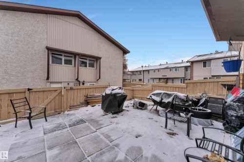 Private fenced backyard featuring a paved patio area - 7 14115 82 Street, Edmonton, AB - Outdoor With Exterior