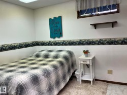 Interior room featuring white walls with a decorative border and a window with a valance - 