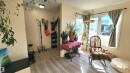 Entryway area featuring light wood-finish flooring, neutral wall paint, a built-in bench, and a flush-mount ceiling light fixture - 3531 46 Street, Edmonton, AB  - Indoor Photo Showing Other Room 