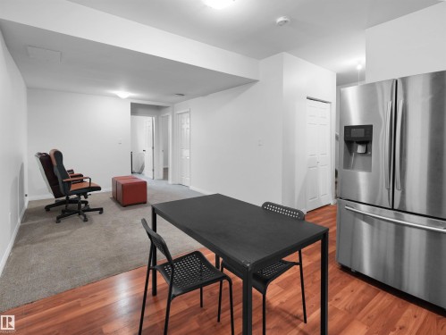 Stainless steel refrigerator with ice and water dispenser - 5192 1B Avenue Sw, Edmonton, AB - Indoor