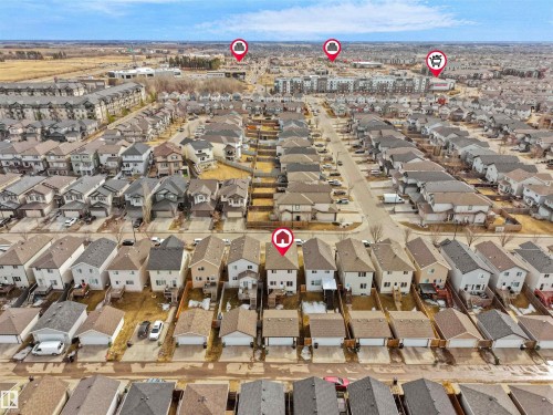 Aerial perspective showcasing a residential development with multiple detached and attached homes - 5192 1B Avenue Sw, Edmonton, AB - Outdoor With View