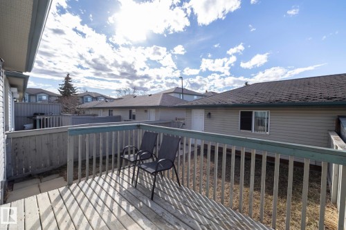 Expansive wood deck with a full railing and privacy fencing - 50 14803 Miller Boulevard, Edmonton, AB - Outdoor With Deck Patio Veranda With Exterior