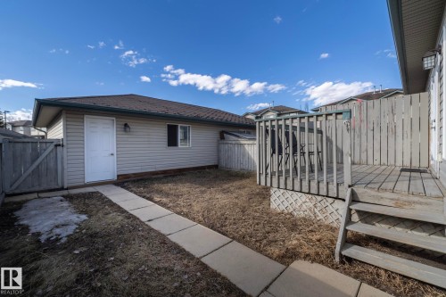 Detached garage with siding exterior and shingle roof - 50 14803 Miller Boulevard, Edmonton, AB - Outdoor With Exterior