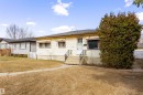 Single-story residence featuring light-colored siding and a dark-shingled roof - 9007 149 Street, Edmonton, AB  - Outdoor 