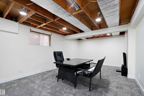 This room features white walls, gray carpeting, and exposed wooden ceiling beams with recessed lighting - 11020 158 Avenue, Edmonton, AB - Indoor Photo Showing Other Room