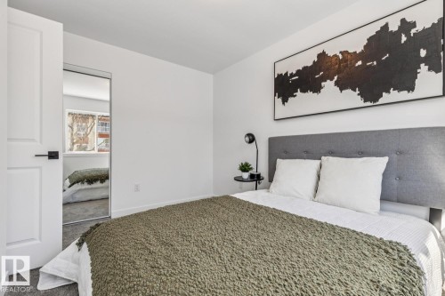 White interior walls with gray carpet flooring - 10726 107 Street, Edmonton, AB - Indoor Photo Showing Bedroom