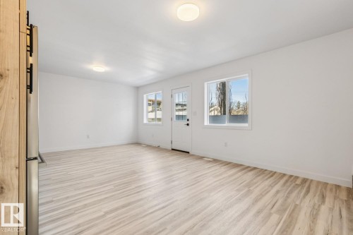 Open room featuring light wood-finish flooring, white walls, and recessed lighting fixtures - 10726 107 Street, Edmonton, AB - Indoor Photo Showing Other Room