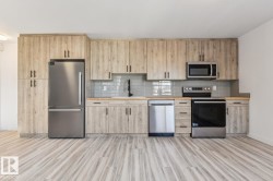 Contemporary kitchen featuring wood-finish cabinetry, stainless steel appliances, and wood-finish countertops - 
