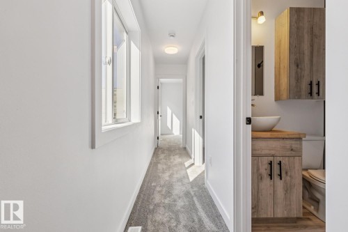 Hallway featuring light gray carpeting, white walls, and a recessed ceiling light - 10726 107 Street, Edmonton, AB - Indoor Photo Showing Other Room
