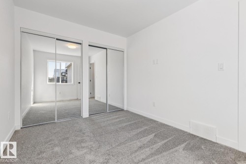 Room with light gray carpet flooring and white painted walls - 10726 107 Street, Edmonton, AB - Indoor Photo Showing Other Room