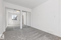 Room with light gray carpet flooring and white painted walls - 