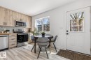 Kitchen space featuring wood-finish cabinetry, stainless steel appliances, and a light-toned wood-finish countertop - 10726 107 Street, Edmonton, AB  - Indoor Photo Showing Kitchen With Stainless Steel Kitchen 