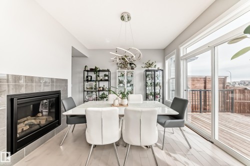 2043 51 Street, Edmonton, AB - Indoor Photo Showing Dining Room With Fireplace