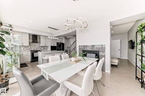 2043 51 Street, Edmonton, AB - Indoor Photo Showing Dining Room With Fireplace
