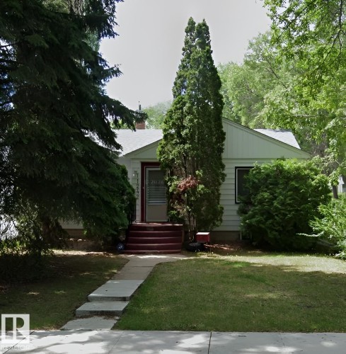 Single-story residence featuring white siding and a light-colored shingled roof - 11242 56 Street, Edmonton, AB - Outdoor
