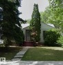 Single-story residence featuring white siding and a light-colored shingled roof - 11242 56 Street, Edmonton, AB  - Outdoor 